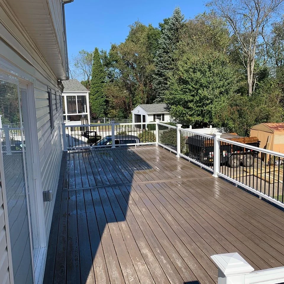 Finished elevated deck surface with railing