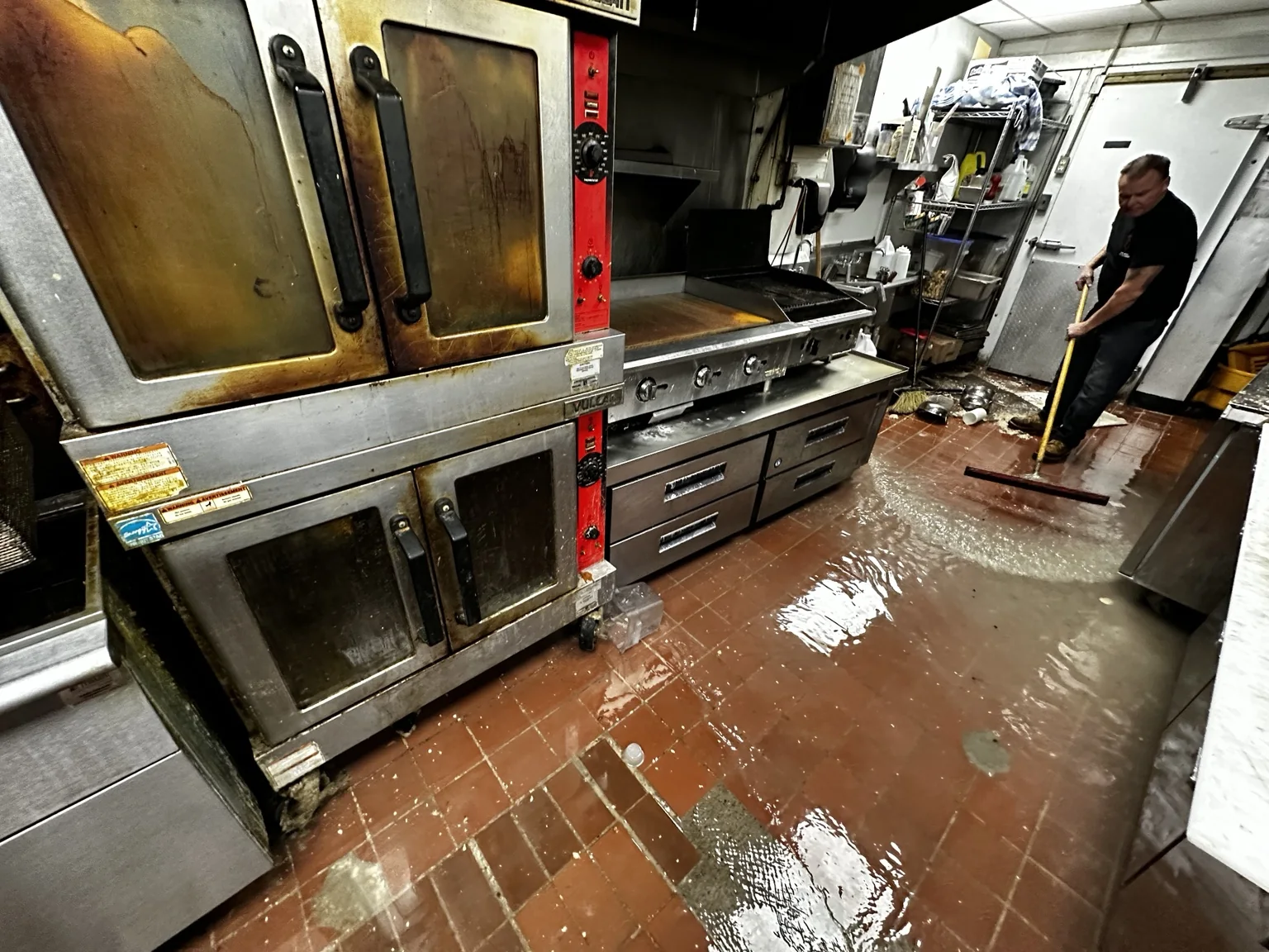 Commercial kitchen water cleanup in progress